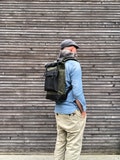 Waxed canvas backpack with roll up top and  leather bottom and outside pocket COLLECTION UNISEX