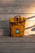 Roll up mustard waterproof backpack Mountains