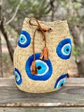 Colorful Embroidered Raffia Drawstring Backpack with Evil Eye for Women Bohemian Style.