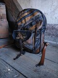 Handcrafted leather large distressed backpack in shades of brown and black, steampunk, grunge, industrial, dirty, postapo style, gear wheels